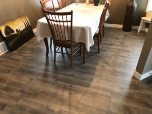 Dining Area with TORLYS Sugar Hill Laminate Flooring in Misty Hollow Oak